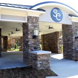 Southern Charm Events - Outdoor pavilion with ceiling fans and fireplace for anytime of the year