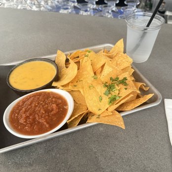 The Roof - Chips with a side of cheese and salsa - Bars Near Me - Salem, Massachusetts