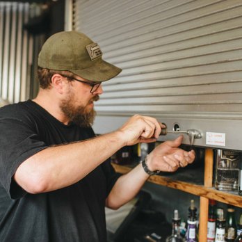 Locksmith Plus, Inc. Bend, OR - A technician rekeying a storage shed. - Keys & Locksmiths Near Me