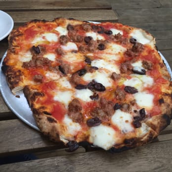 Ogliastro - Salsiccia Pizza: tomato, fior di latte, housemade sausage, olives - Pizza Near Me - Brooklyn, New York Ogliastro - Salsiccia Pizza: tomato, fior di latte, housemade sausage, olives - Pizza Near Me - Brooklyn, New York