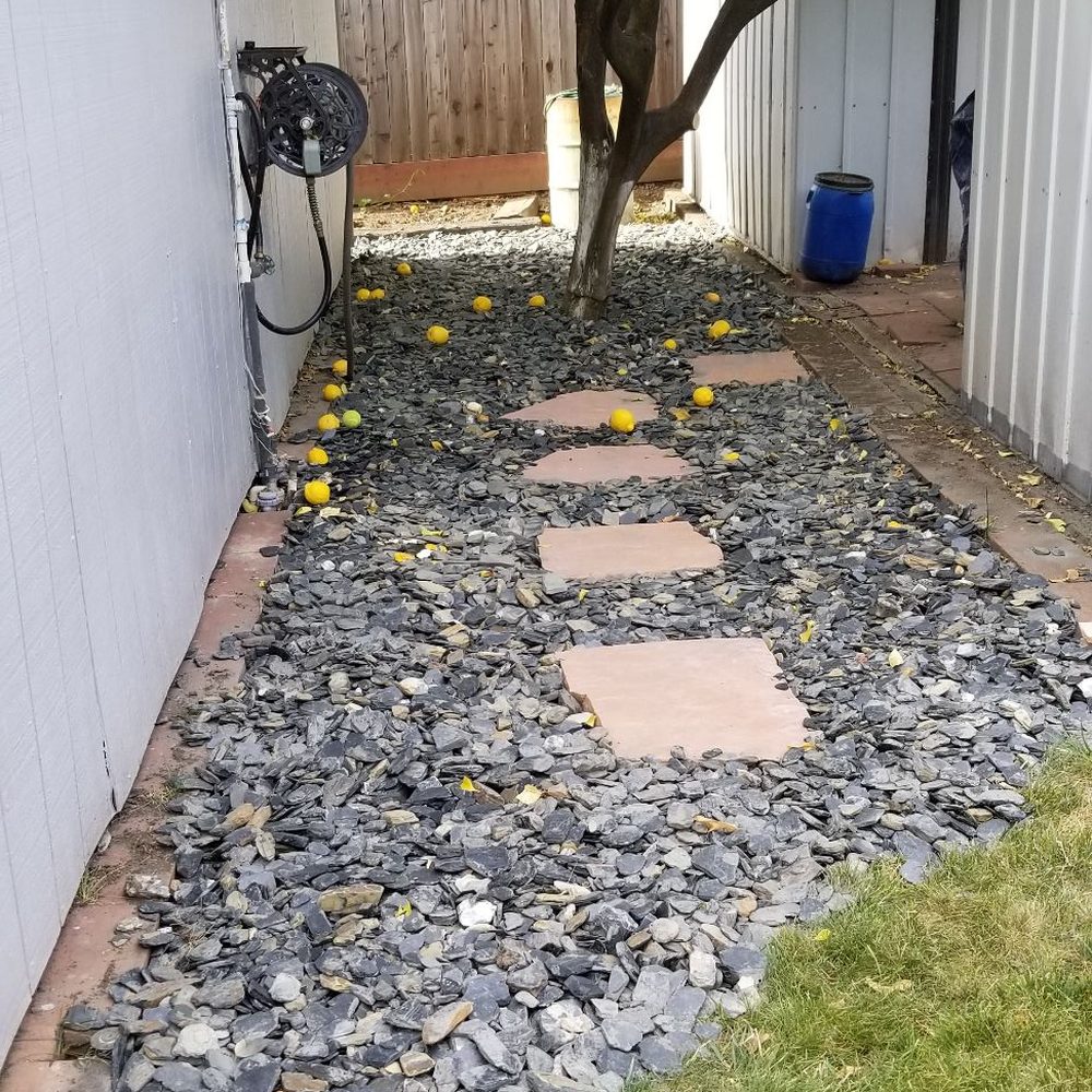 Zoe Landscaping - Grass was removed & gray slate pieces installed. Brown slate stepping stones added to accent the layout. 660sq ft of grass was removed. - Landscape Architects or Designers Near Me