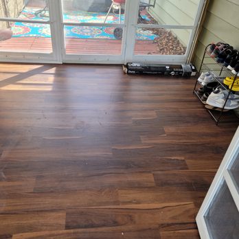 Erik's Helping Hands - We modernized a three seasons entryway by removing green outdoor carpet and replacing with a durable vinyl plank floor. - Handyman Near Me - Milwaukee, Wisconsin Erik's Helping Hands - We modernized a three seasons entryway by removing green outdoor carpet and replacing with a durable vinyl plank floor. - Handyman Near Me - Milwaukee, Wisconsin