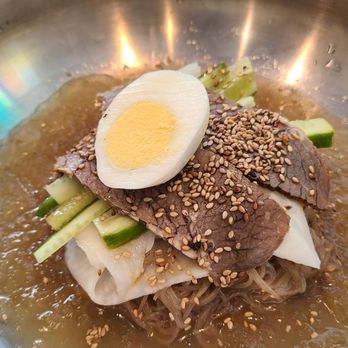 Noona Noodles - Icy Spicy with spice on the side. Chilled noodles, cucumber, pickled radish, egg & brisket in an incredible slush textured soup - Noodles Near Me - New York, New York Noona Noodles - Icy Spicy with spice on the side. Chilled noodles, cucumber, pickled radish, egg & brisket in an incredible slush textured soup - Noodles Near Me - New York, New York