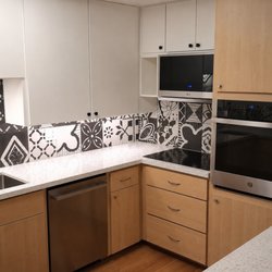 Modern maple cabinet refacing in Satin White and Acorn by Pacific Kitchens.