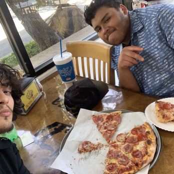 Royal Pizza - Me and my friend eating the pizza - Chicken Wings Near Me - San Antonio, Texas Royal Pizza - Me and my friend eating the pizza - Chicken Wings Near Me - San Antonio, Texas