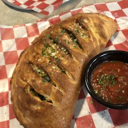 Alpha Omega Grill & Pizzeria - The best stromboli in town! You will not be disappointed.. (I added some spice with the jalapeños)