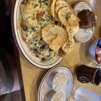Omelet House - Egg white omelette with turkey sausage, pumpkin bread, potato chip like soft potatoes, and sausage gravy on the side - Breakfast & Brunch Near Me - Las Vegas, Nevada