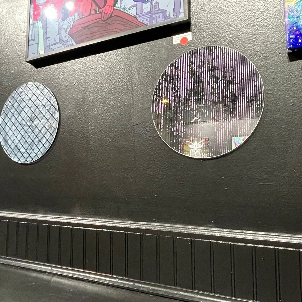 Petra's Bar - a row of mirrors on the wall - Piano Bars Near Me - Charlotte, North Carolina