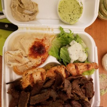The Green Olive - #10 Gyro mix, beef kabob, gyro, marinated chicken, salad & hummus. Baba ghanoush top left & special green sauce. - Mediterranean Near Me - Gardena, California The Green Olive - #10 Gyro mix, beef kabob, gyro, marinated chicken, salad & hummus. Baba ghanoush top left & special green sauce. - Mediterranean Near Me - Gardena, California