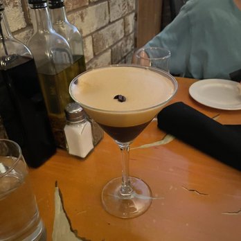 Di Gusto - a cocktail in a martini glass on a table - Italian Near Me - Sudbury, Ontario