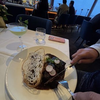 Mister A's - Short rib with bone marrow (tucked under the bread) - New American Near Me - San Diego, California Mister A's - Short rib with bone marrow (tucked under the bread) - New American Near Me - San Diego, California