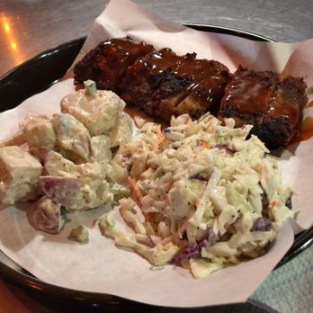 Phil's BBQ - Half rack baby back ribs + potato salad + cole slaw - Barbeque Near Me - San Diego, California Phil's BBQ - Half rack baby back ribs + potato salad + cole slaw - Barbeque Near Me - San Diego, California