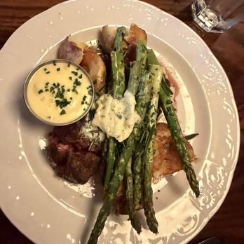 Butcher's Union - 8 oz. Hanger with smashed yukon potatoes, grilled asparagus, rosemary butter, bernaise, chives, fried rosemary - American Near Me - Grand Rapids, Michigan