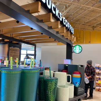 Starbucks - a starbucks coffee shop with a man standing in front of it - Coffee & Tea Near Me - Eagle, Colorado Starbucks - a starbucks coffee shop with a man standing in front of it - Coffee & Tea Near Me - Eagle, Colorado