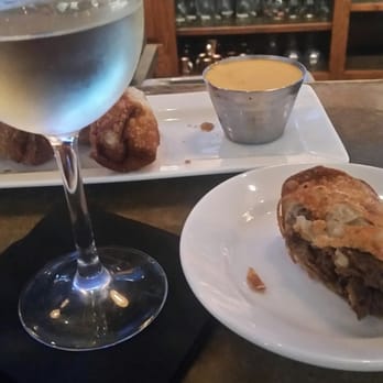 Station Tap House - Sav blanc and cheese steak egg rolls at the bar.  Request a side of whiz to dip in!  Does not normally come with the size of whiz. - American Near Me - Doylestown Boro, Pennsylvania