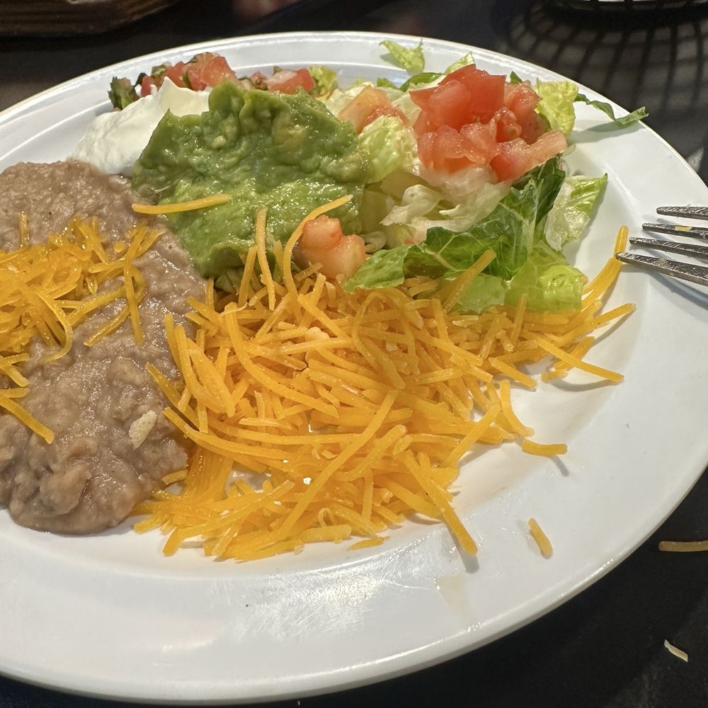 Shredded cheese from a bag with cellulose. Shredded cheese from a bag with cellulose.