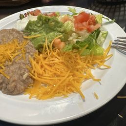 Shredded cheese from a bag with cellulose. Shredded cheese from a bag with cellulose.