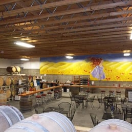 A nice view of the tasting room at Tanjuli Winery. This shows their huge mural and lovely barrels. A nice view of the tasting room at Tanjuli Winery. This shows their huge mural and lovely barrels.