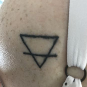 Tatto and Body Piercing - The photo isn't blurry, that's actually how terrible this tattoo is. A child could have done better than this. Uneven lines, blowout. - Tattoo Near Me - Middletown, New York