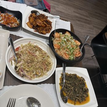 Burma Silver Star - Burmese Mango Pickle Salad (left), Chin Baung Kyor (bottom right), Garlic Noodle (top right), Spicy Crispy Fish (top middle) - Burmese Near Me - Daly City, California Burma Silver Star - Burmese Mango Pickle Salad (left), Chin Baung Kyor (bottom right), Garlic Noodle (top right), Spicy Crispy Fish (top middle) - Burmese Near Me - Daly City, California