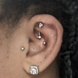 Island Ink - Rook piercing. Got a larger piece of jewelry for my long nails