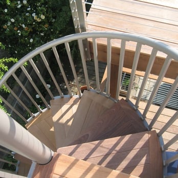 Stellar Construction Plus Design - a wooden spiral staircase - General Contractors Near Me Stellar Construction Plus Design - a wooden spiral staircase - General Contractors Near Me