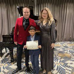 Angeles Academy of Music - Receiving his latest certificate at his piano performance.