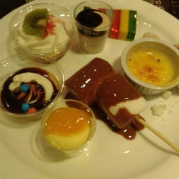 Lemon mousse, caramel with cream, custard kiwi & banana, coffee mousse, coloured jelly, creme brulee & marshmallows in chocolate