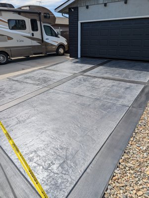 Driveway Concrete (Stamped/textured) - Expert installation of durable and long-lasting concrete driveways, tailored for functionality, curb appeal, and lasting performance.