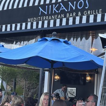 Nikanos - The awning above some patrons - Greek Near Me - Ogunquit, Maine