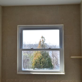 Creative Design Ceramic Tile & Bath - a window in a bathroom - General Contractors Near Me - Lake Grove, New York