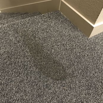 Eddyline at Bridgeport - Stained carpet in the stairwell. This stain has been present for at least three months, with no clear attempt to clean or remove it. - Apartments Near Me - Portland, Oregon Eddyline at Bridgeport - Stained carpet in the stairwell. This stain has been present for at least three months, with no clear attempt to clean or remove it. - Apartments Near Me - Portland, Oregon