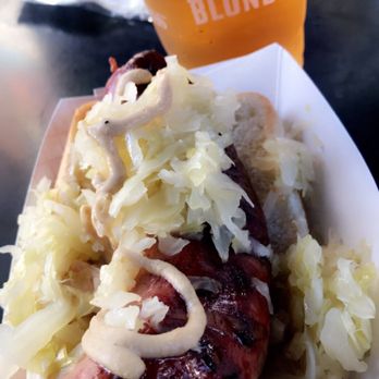 SALT At Our Kaka'ako - Corned beef sausage served at St patrick block party with a cup of guinness blond - Shopping Centers Near Me - Honolulu, Hawaii
