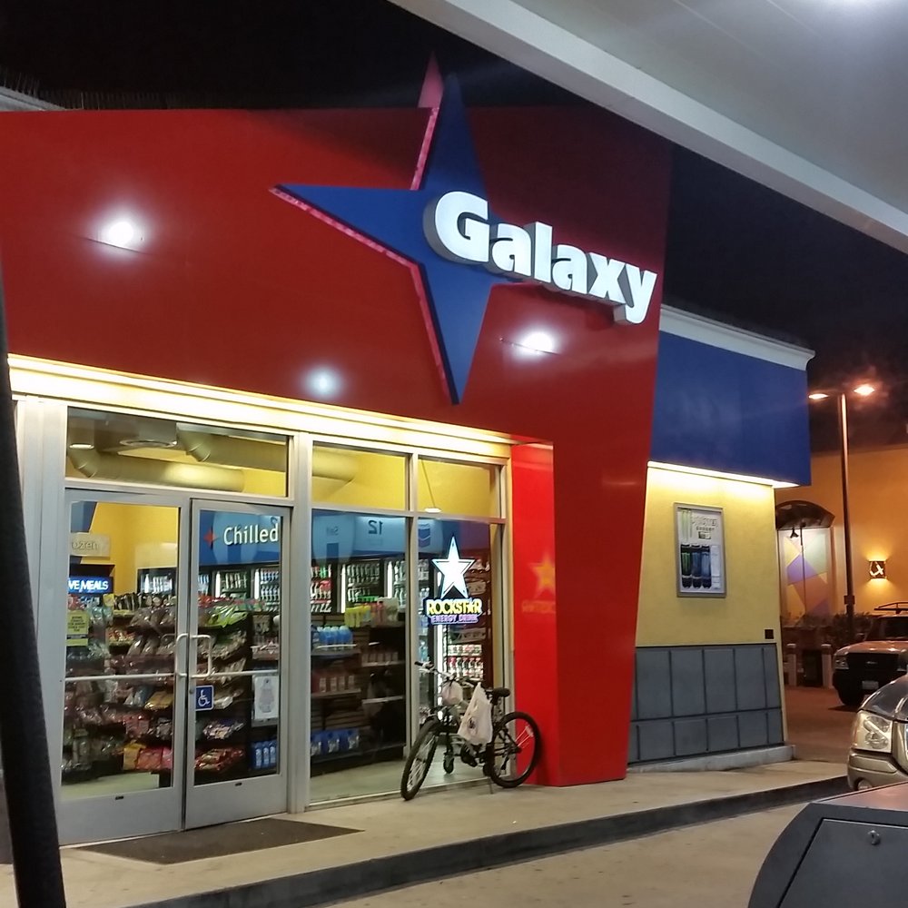 the front of a galaxy store at night the front of a galaxy store at night
