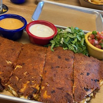 Avenue American Bistro - Chicken cheese quesadilla with chipotle alio and lime creme - Sports Bars Near Me - Wayne, Michigan