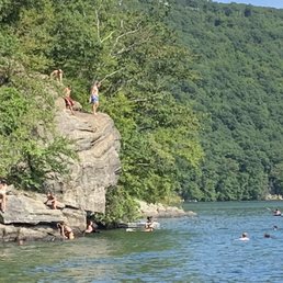 This is Chicken Rock North on the lake right side. With a rope swing. Fantastic. Anchor and hang with young and old.