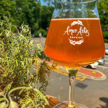 Amor Artis - Peach sour outside on the rooftop patio - Brewpubs Near Me - Fort Mill, South Carolina Amor Artis - Peach sour outside on the rooftop patio - Brewpubs Near Me - Fort Mill, South Carolina