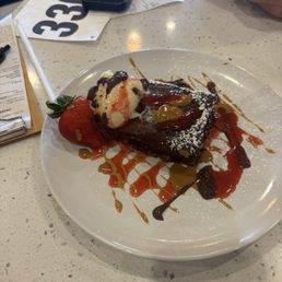 This was a chocolate cake with vanilla ice cream drizzled with caramel, chocolate and strawberry sauce! So good!!