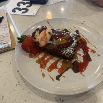 Josefina's Cocina - This was a chocolate cake with vanilla ice cream drizzled with caramel, chocolate and strawberry sauce! So good!! - Latin American Near Me - Richardson, Texas