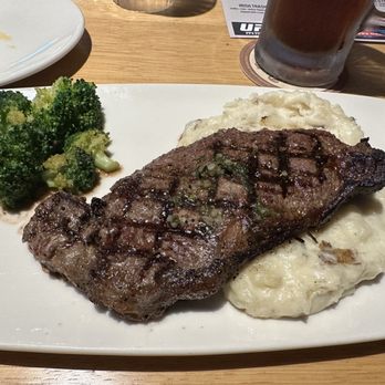 Twin Peaks - The NY Strip, medium with broccoli and garlic mashed. - Sports Bars Near Me - Daytona Beach, Florida Twin Peaks - The NY Strip, medium with broccoli and garlic mashed. - Sports Bars Near Me - Daytona Beach, Florida