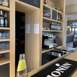 Hôtel Restaurant St Roch - Empty bar and front desk as all out smoking and drinking. The guy literally started his shift Les then ten minutes ago.