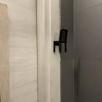 Pizzeria O' Vesuvio Firenze - Funny little bag hook in the bathroom that looks like a miniature chair - Pizza Near Me - Florence, FI
