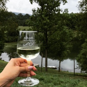 Rebel's Run at afton mountain - Taking a break from riding with a glass of Afton Mountain Vineyards sweet Mountain White wine - Horseback Riding Near Me - Afton, Virginia Rebel's Run at afton mountain - Taking a break from riding with a glass of Afton Mountain Vineyards sweet Mountain White wine - Horseback Riding Near Me - Afton, Virginia