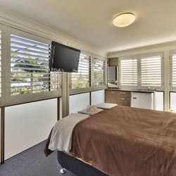 Colorado Shutter Company - Create a patio bedroom with Aluminum hurricane rated shutters