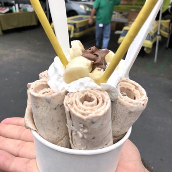 Honey Rolls Ice Cream - a hand holding a cup of ice cream - Ice Cream & Frozen Yogurt Near Me Honey Rolls Ice Cream - a hand holding a cup of ice cream - Ice Cream & Frozen Yogurt Near Me