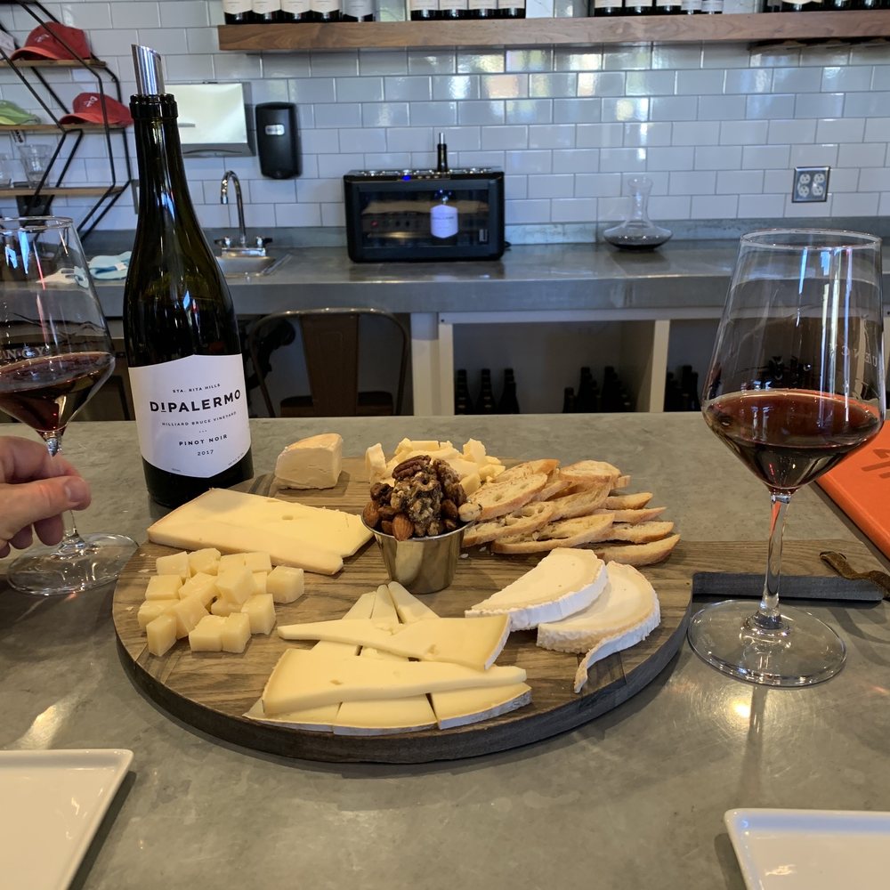 Frequency Wine - Bar seating with a cheese board from the cheese shop next door - Wine Tasting Room Near Me - Santa Barbara, California Frequency Wine - Bar seating with a cheese board from the cheese shop next door - Wine Tasting Room Near Me - Santa Barbara, California