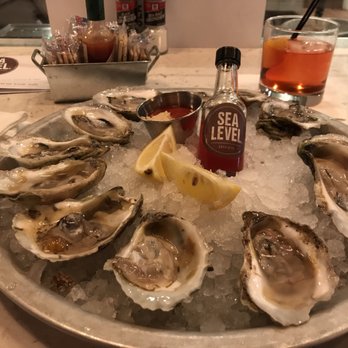Sea Level NC - Sea level oysters $1 during HH 4-7 and 10-12 - Seafood Near Me - Charlotte, North Carolina