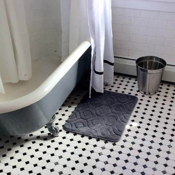 Coast Tile & Marble Supply - a claw foot bathtub in a bathroom - Flooring Near Me - Egg Harbor Township, New Jersey