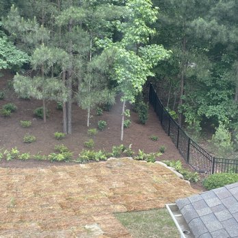 Green Tek Landscaping - Plantings behind new retaining wall after cleared back area of brush and trees - Landscaping Near Me - Indian Trail, North Carolina Green Tek Landscaping - Plantings behind new retaining wall after cleared back area of brush and trees - Landscaping Near Me - Indian Trail, North Carolina
