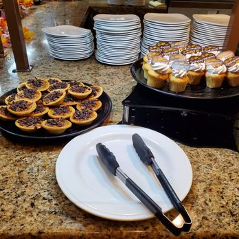 Harvest Dining Hall - a counter with plates of pastries and desserts - American Near Me - Brooks, California